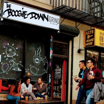 The Boogie Down Grind cafe storefront with chalk art windows